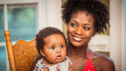 Smiling mother with baby